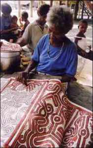 Maisin women, papua New Guinea, painting barkcloths. The red paint is applied warm and used to be associated with blood and taboo for men and children. 
